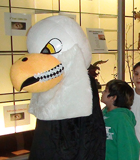 School mascot in the hallway with students