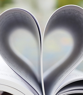 open book with pages in shape of heart